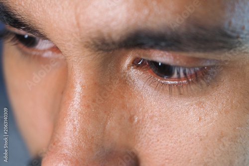 Tablou pe pânză Close view of a man's eyes showing focus and concentration