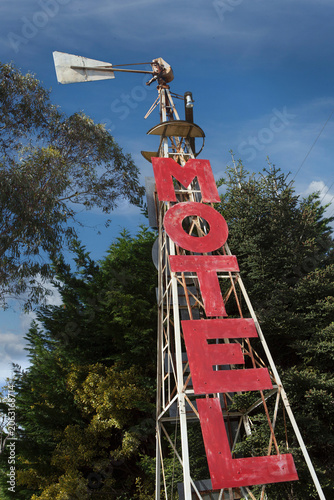 Abandoned windmill with motel sign in New Zealand
