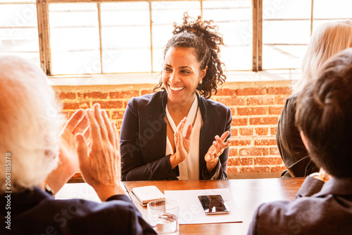 Obraz na plátne Business meeting with diverse professionals clapping