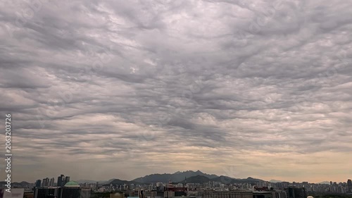 Cloudscape, Timelapse of Rippled Asperitas Storm Clouds over Seoul City Skyline with Mountains for Weather Background