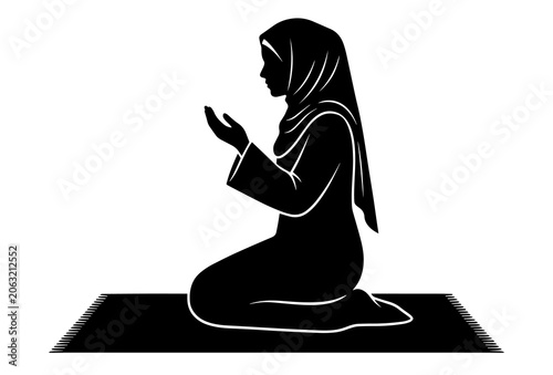 Fotografía Muslim woman silhouette praying on a rug in a respectful kneeling position with