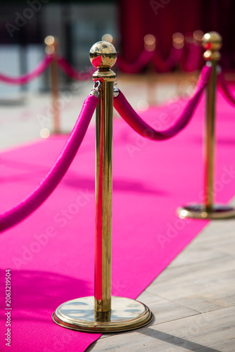 Red Carpet with Golden Stanchions and Red Velvet Ropes at VIP Event Entrance