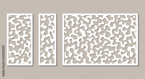 Bild auf Leinwand Three white decorative laser cut panels with organic abstract wavy amoeba fluid shapes on taupe background elegant modern screening element