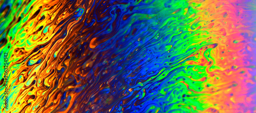 Rainbow iridescent fluid texture, macro abstract background