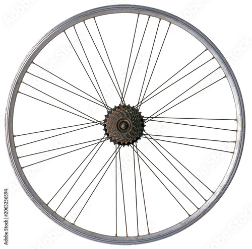 An old, slightly rusty bicycle wheel without a tire on an isolated background. The spokes have a unique arrangement.