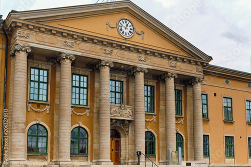Karlskrona, Sweden - 14 September 2025: View of the neoclassical facade of the Blekinge District Court with its grand stone columns and clock on the pediment at Stortorget.