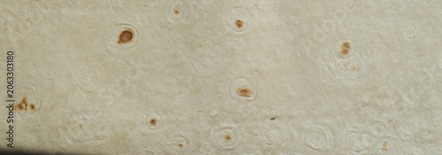 Thin pita bread texture background. Armenian pita bread unleavened flat bread. Freshly baked