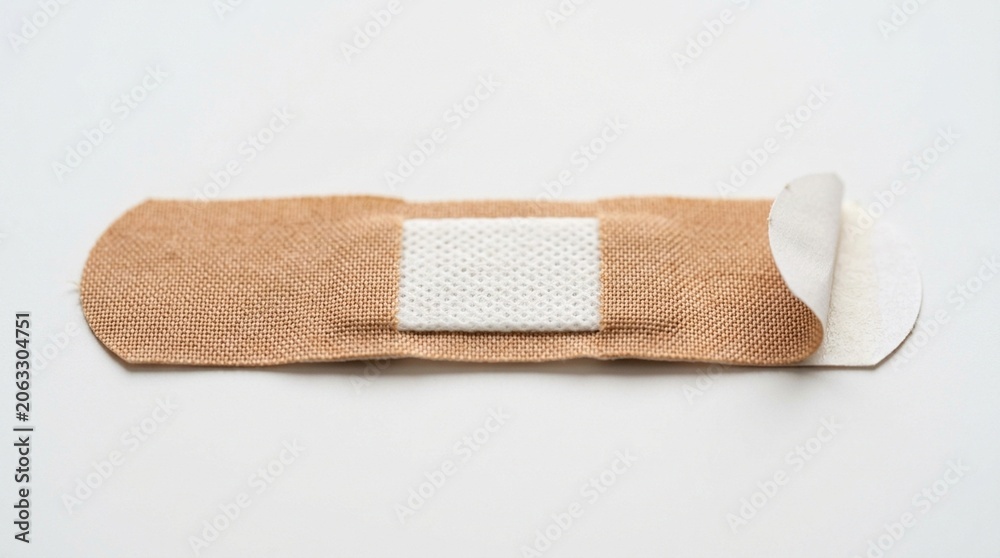 Obraz premium Adhesive bandage strip isolated on white background for first aid and wound care