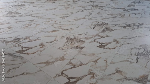 Marble Look Porcelain Tile Floor Installed in Modern Room.