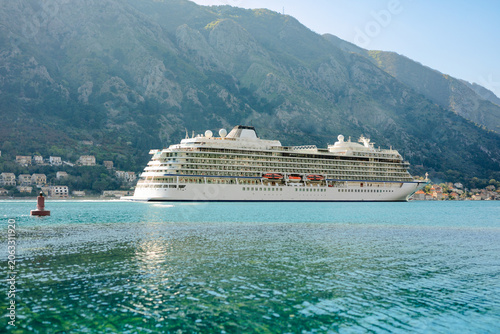 Photos Side view of a cruise ship in the Bay of Kotor in Kotor Montenegro with turquoise water