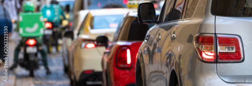 Heavy traffic jam with multiple cars stuck in congestion on busy urban road, city rush hour, transportation delay, and everyday metropolitan mobility struggle concept.