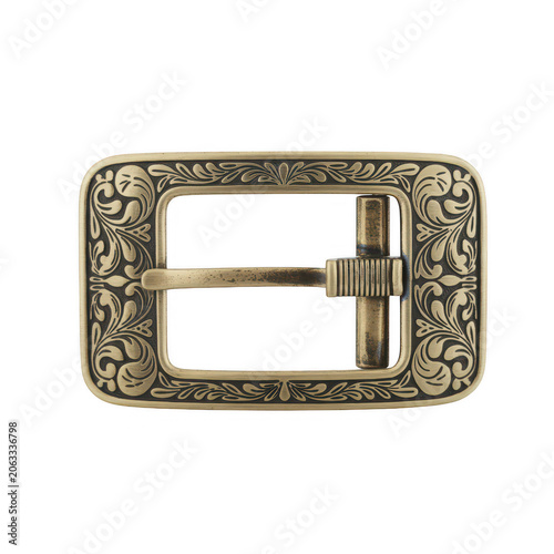 Detailed brass belt buckle with intricate floral scrollwork engraving and a textured central pin, isolated on a white background, macro