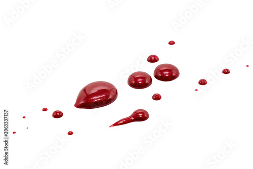 Droplets of thick red liquid or paint splattered , abstract fluid texture with organic shapes and glossy surface finish