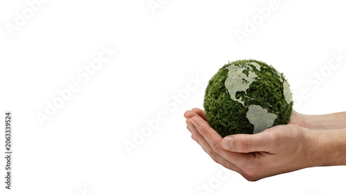 Human hands holding a small spherical globe covered in green moss, representing environmental conservation and global ecology awareness