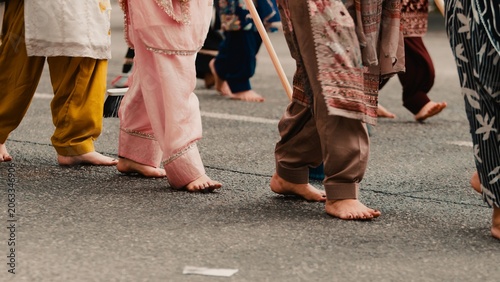 Indian women walk barefoot during the Vaisakhi religious day