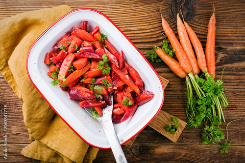 Cuadro en lienzo Easy homemade carrot salad with marinated carrots and beets served as top view i