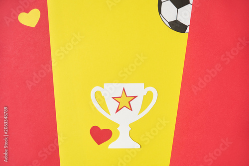 Paper hearts in red and yellow, the colors of the Spanish flag, and a trophy symbolizing victory and national pride