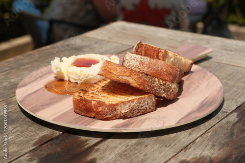 Sour dough with hot honey garlic dip on a sunny day