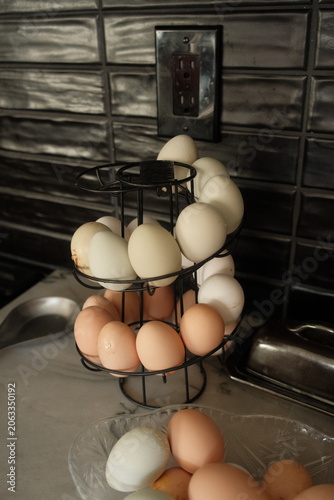 Multi colored farm fresh eggs on a spiral rack