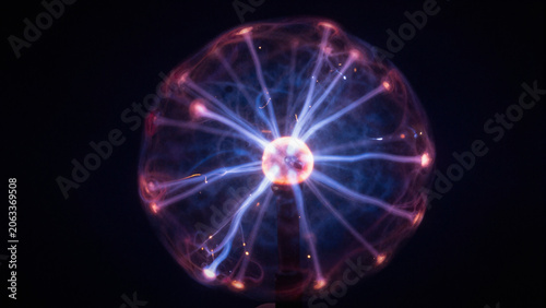  plasma ball lightning with electric sparks in a dark background