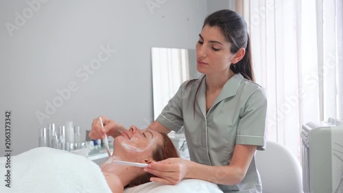 Enjoy a soothing skincare treatment at a tranquil spa as a skilled expert applies gentle care and nourishing products, enhancing natural beauty and relaxation.