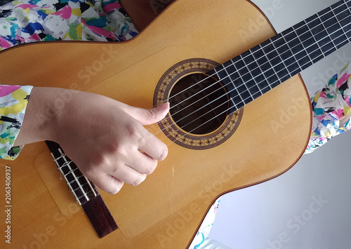 Close up of the flamenco guitarist right hand in a sunny day