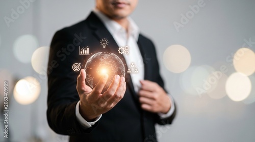 Business professional holding glowing heart symbol in office with soft bokeh lighting