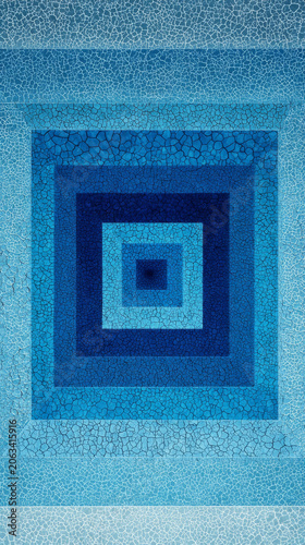 Vibrant abstract image showcasing tunnel like pattern with cracked texture in various shades of blue, creating mesmerizing visual effect