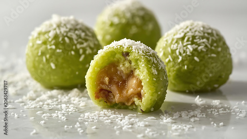 Healthy Green Energy Balls with Coconut Flakes, One Bitten Open