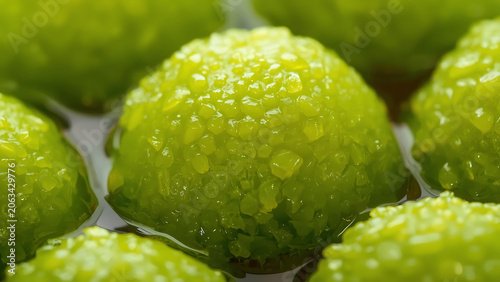 Macro Close-up of Fresh Green Limes Covered in Water Droplets
