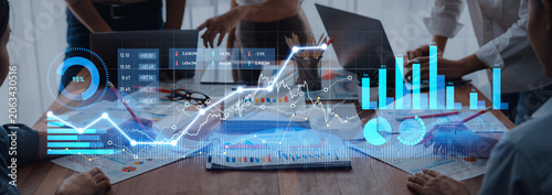 Cuadro en lienzo A professional team engages in financial analysis, utilizing digital graphs and charts to interpret data insights in a modern office environment, enhancing decision-making