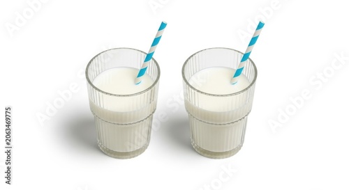 Two glasses of milk with blue and white striped straws isolated on white background