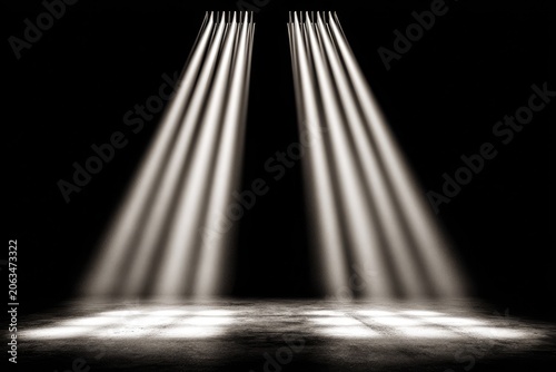 Spotlight beams on a dark stage