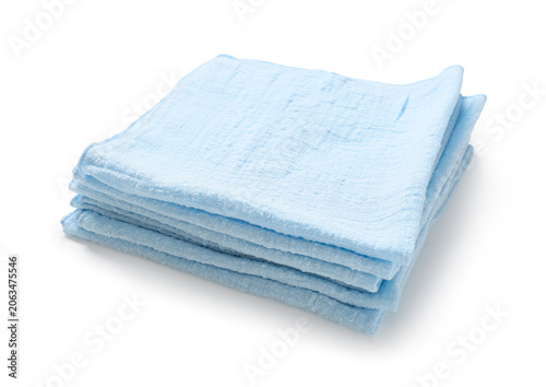 Stack of folded light blue ...