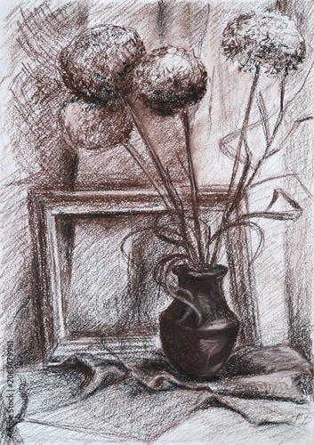 Still life with a bouquet of dried flowers in a ceramic vase, placed next to a photo frame.