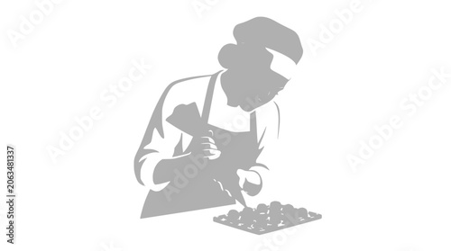 Foto Pastry Chef Decorating Tiny Cakes with Piping Bag