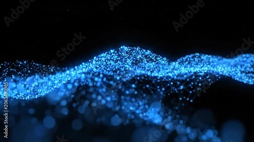 Blue particle wave on black background.