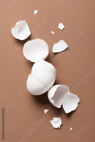 Egg shells on brown background