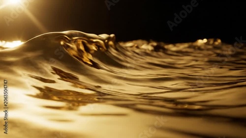 Golden light on water surface waves.