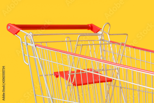 Shopping cart on yellow bac...