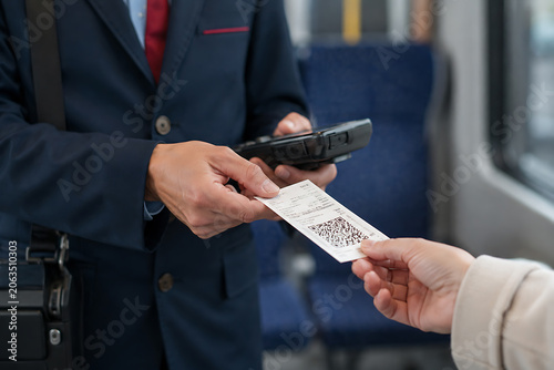     Public Transport Ticket Inspector Verifying Passenger Ticket