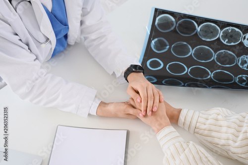 Female doctor with patient ...