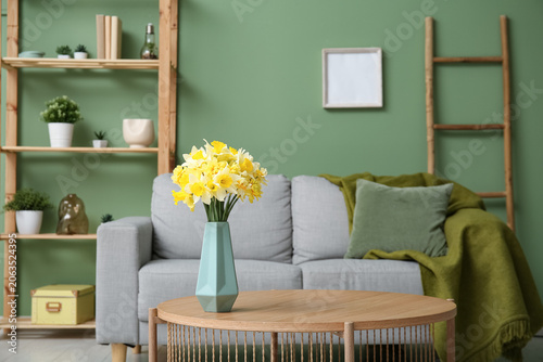 Vase with beautiful daffodi...