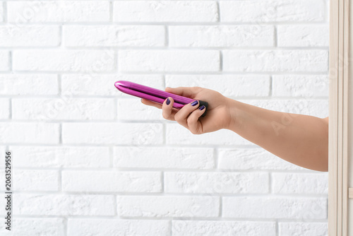 Female hand with purple vib...