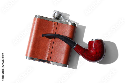Fényképezés New hip flask and smoking pipe isolated on white background