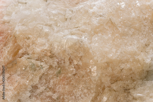 Schilderij op canvas Closeup pink Himalayan salt crystals reveal translucent granular halite with coa