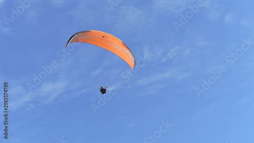 Paragliding on the background of blue sky. Live a healthy life. Be H3althy