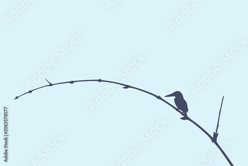 Silhouette of a kingfisher perched on a curved branch against a soft blue background. Ideal for nature, wildlife, conservation, branding, education and posters.