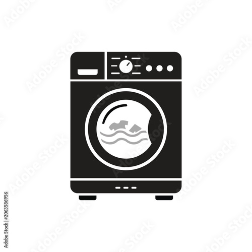 Front view of modern black washing machine with smiling face design on door in minimalist setting
