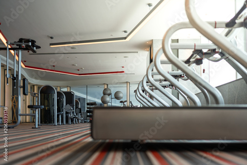 Modern premium gym interior with arranged fitness equipment scene